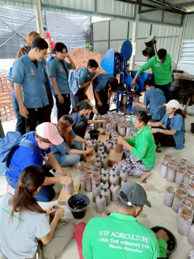 Participants working together at the farm
