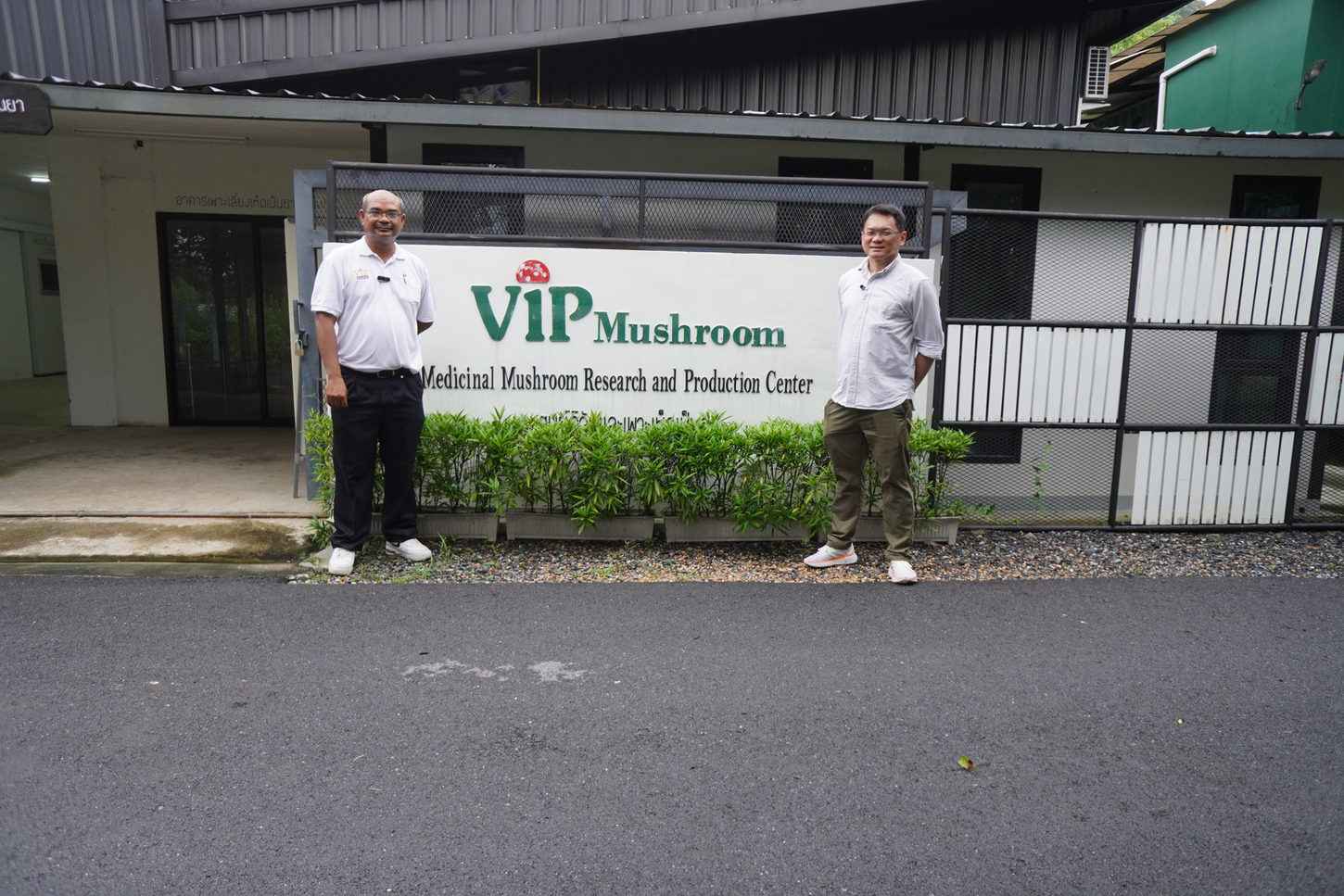 Visitors at VIP Mushroom farm sign